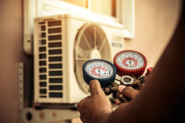 Professional Air Conditioning Service technician working in West Point, UT